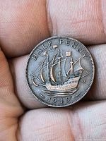 reverse showing HMS Golden Hind and date 1949