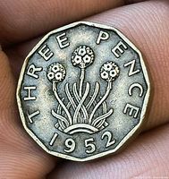 Reverse side of 1952 brass threepence showing thrift plant and date