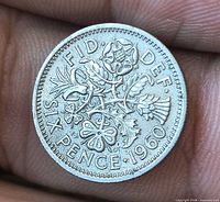 Reverse showing floral emblem design, denomination SIX PENCE, date 1960