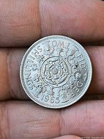 Reverse of 1965 florin showing Tudor rose, national emblems, denomination and date