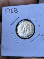 Reverse view of coin in 2x2 flip showing Bluenose schooner and 1968 date