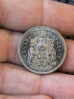 Reverse of 1966 50-cent coin showing coat of arms and date 19-66