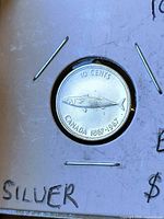 Reverse of 1967 Canadian dime with fish design