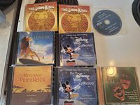 Front covers of all eight CDs displayed on countertop