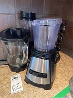Both blenders and spice rack on countertop