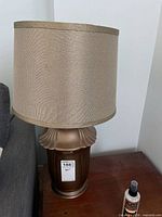 Full view of lamp with shade on side table