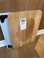 Front view of both cutting boards leaning against wall