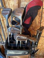 Top view of bag showing various club heads, headcovers visible