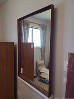 Front view of mahogany wood framed mirror