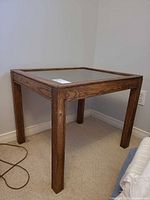 Overall view of oak veneer glass-top square end table