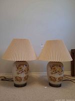 Full view of both matching ceramic table lamps with shades