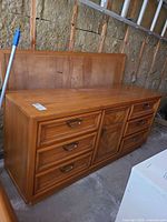 Front view of dresser showing drawer layout and handles