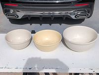 Front view showing three graduated ceramic mixing bowls