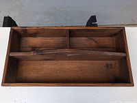 Top view showing overall toolbox, three compartments and central handle