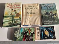 Five books laid out showing front covers