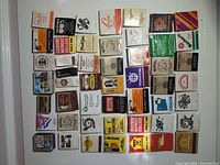 All matchbooks laid out in grid, showing quantity and variety