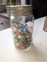 Jar filled with multicolor marbles
