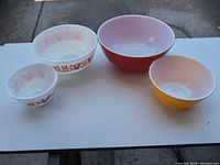 Four nesting bowls showing interior colors and patterns