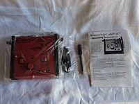 Front view of SS-D control unit, handpiece, power cord, manual in packaging