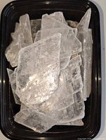 Tray holding multiple translucent selenite blades