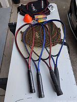 Overview of racquets, bag, speeders and cones on table