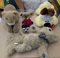 Group shot of six stuffed toys on tabletop