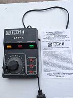 Front view of Tech II Railmaster 2400 controller with manual