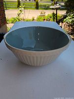 Top view of cream exterior, teal interior Easimix bowl
