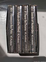 Spines of the four paperbacks in slipcase