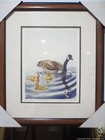 Framed print showing Canada Goose with goslings, full view including frame and mat