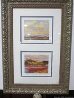 Full view of framed double print showing ornate wood frame and both matted prints