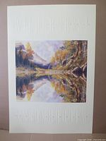 Poster showing landscape artwork and embossed title