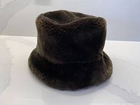 Front view of brown faux fur bucket hat