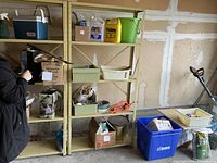 Front view of beige metal shelving unit with five shelves, contents on shelves not included