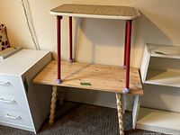 Both tables: laminate table resting atop pine table showing size and design
