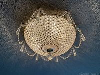 Full view of flush-mount chandelier attached to ceiling