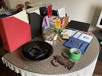 Overview of assorted decor and office items on table