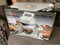 Box front showing EzCook AX-737M Turbo Oven image and extender ring note