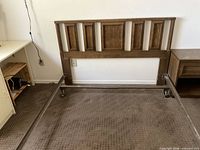 Full view of headboard attached to metal frame