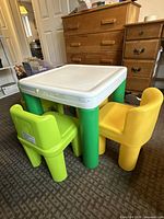 Table and two chairs front view