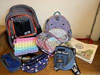 Group shot of all eight bags and pouches