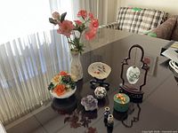 Overall view of the eight decorative items on table
