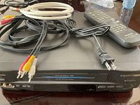Front and top view of Panasonic PV-4559 VCR with remote, RCA and coax cables