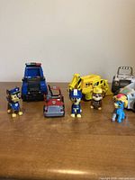 Group of Paw Patrol vehicles and figures on tabletop