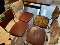 All four mixed-upholstery chrome chairs