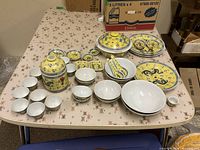 Entire set laid out on table showing quantity and variety of pieces