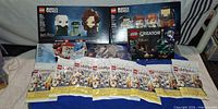 Overview of all LEGO items including BrickHeadz boxes, minifigure blind bags, Creator polybag and loose parts bag