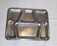 Front view of metal tray showing six compartments