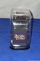 Watch in closed branded display case front view