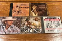 Front view of five country music CDs in jewel cases